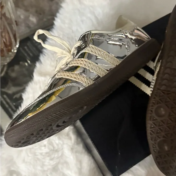 Adidas Women's Silver Sneakers screaming attention. Fly for real